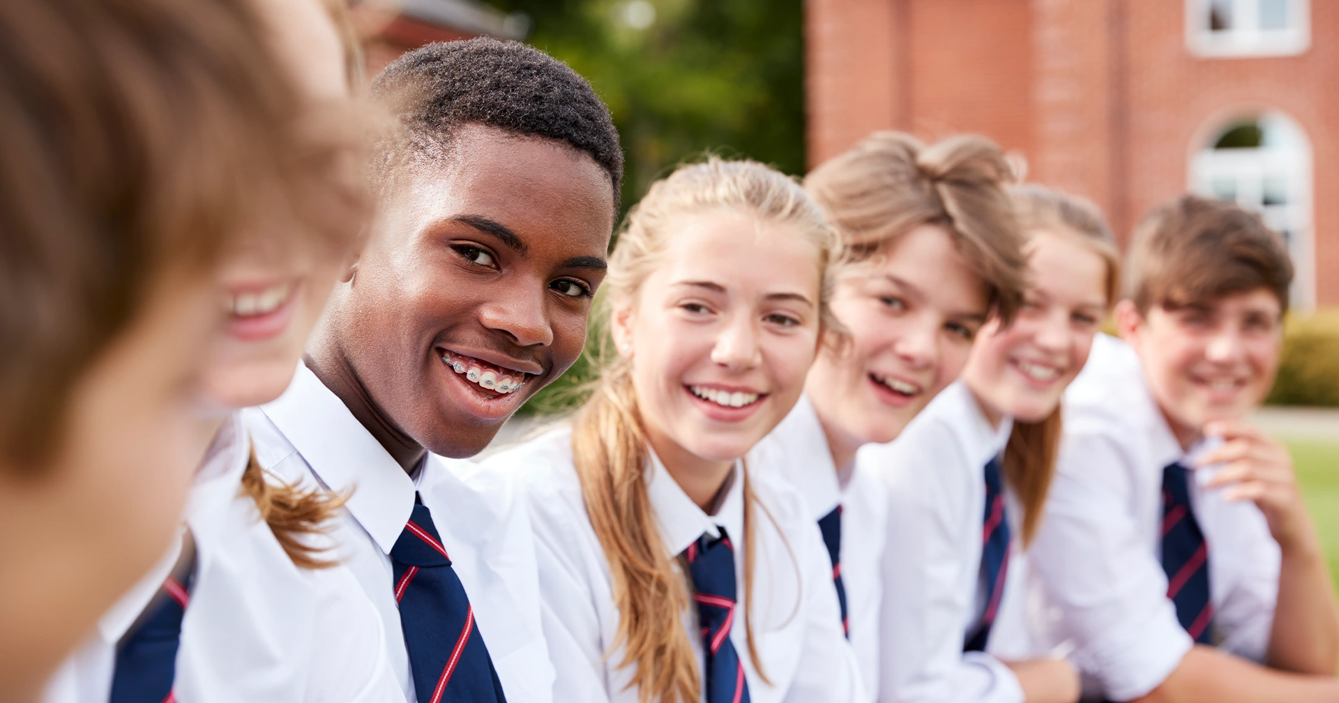 Group of boarding school students in uniforms