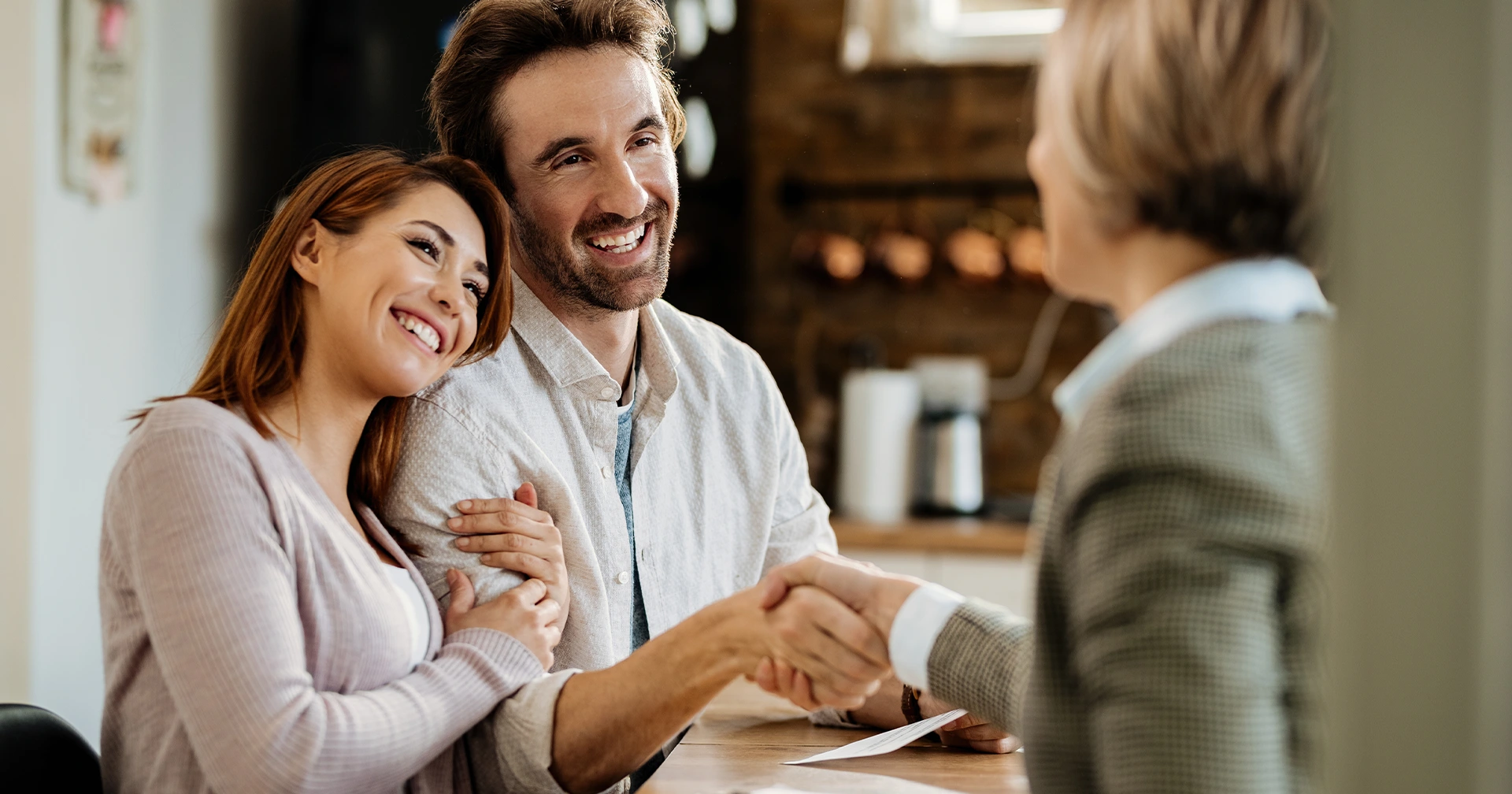 Parents shaking hand with nominated guardian