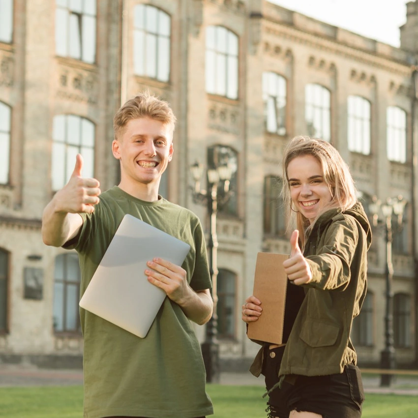 College students with books in front of a college