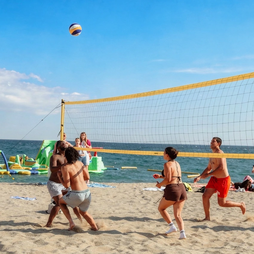 summer school students on the beach playing volleyball